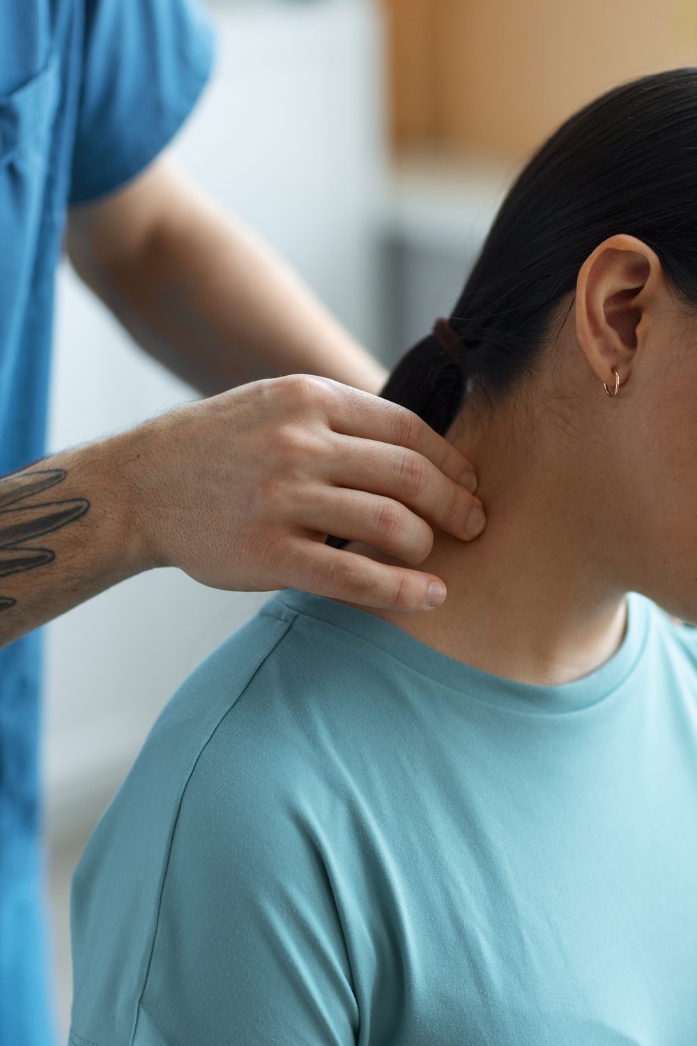 Physiotherapist treating a patient in a clinic setting