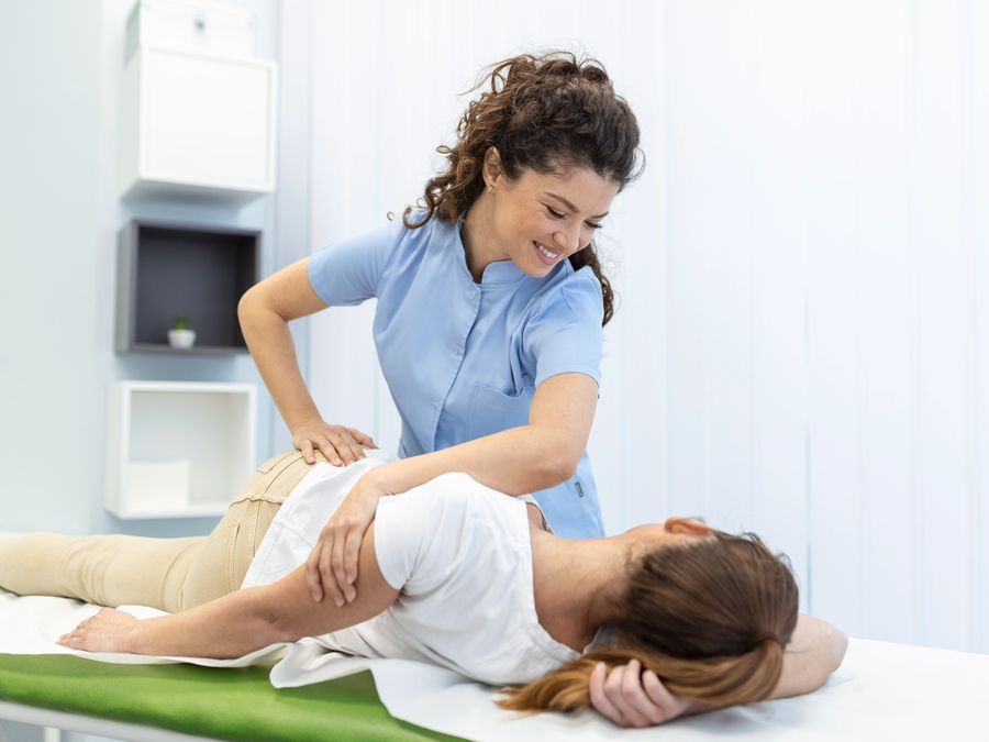 Therapist performing hands-on spinal manual therapy
